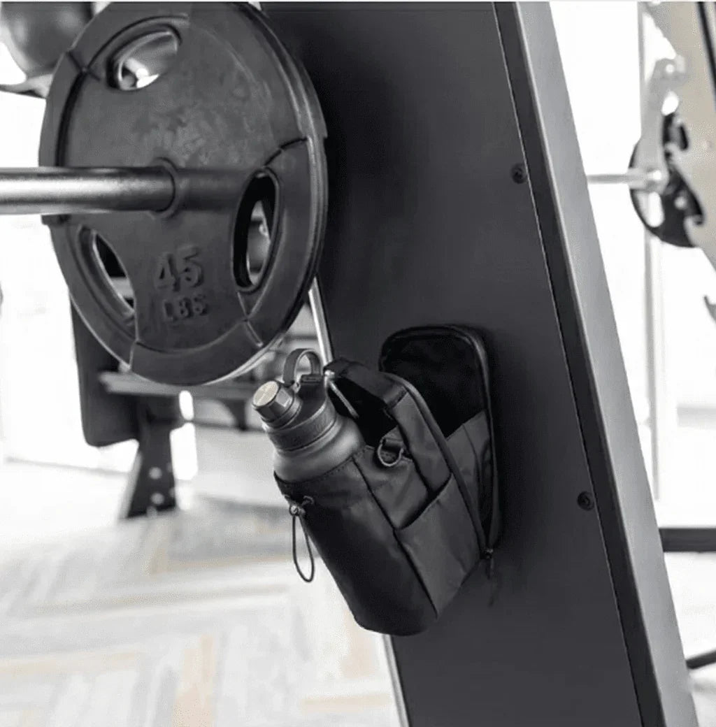 Magnetic Gym Bag from GlenNest holding a water bottle, attached to gym equipment