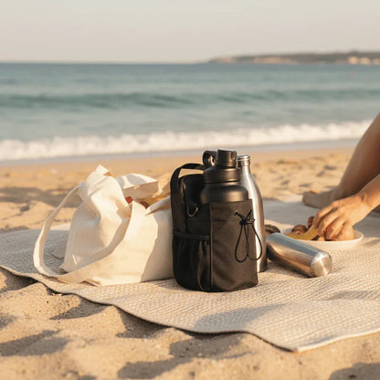 Magnetic Gym Bag and water bottles on beach mat, GlenNest essentials for outdoor use