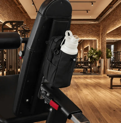 Magnetic Gym Bag with water bottle attached to gym equipment in modern fitness center